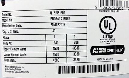 Close-up of a Rheem manufacturer's rating label showing the Serial No., Model No., and Manufacture Date lines